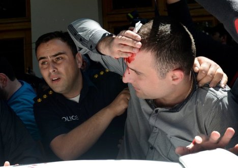 Priests of the Orthodox Church of Georgia beating a man for being Gay. Priests! (Reuters)
